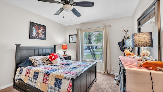 bedroom with light colored carpet, baseboards, and ceiling fan