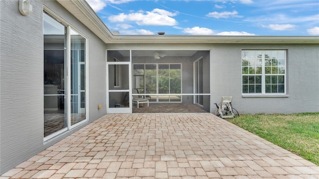 view of patio with a sunroom