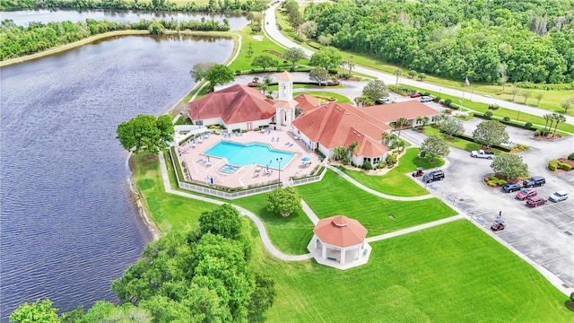 birds eye view of property with a water view
