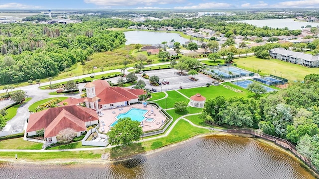 birds eye view of property with a water view