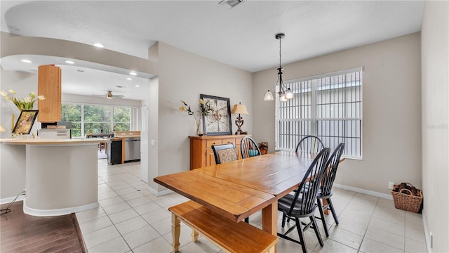 dining area with recessed lighting, baseboards, light tile patterned floors, and ceiling fan with notable chandelier