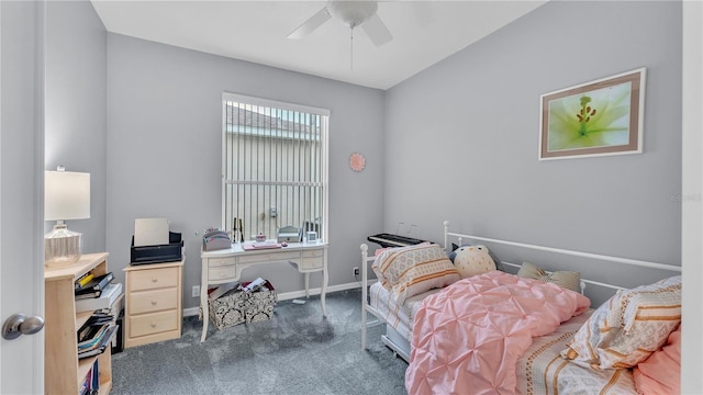 carpeted bedroom with a ceiling fan and baseboards