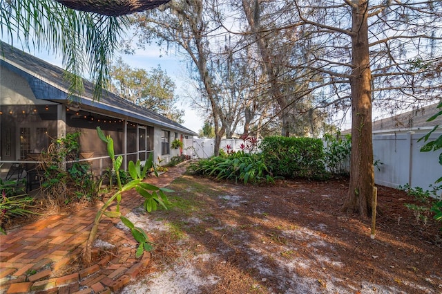 view of yard featuring a sunroom