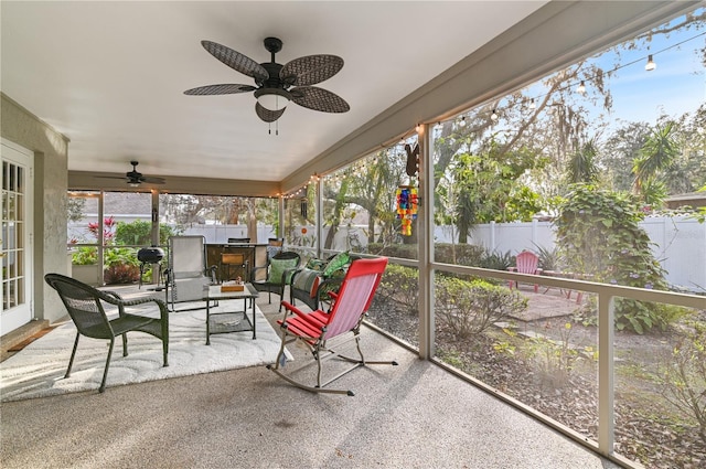 sunroom / solarium with ceiling fan