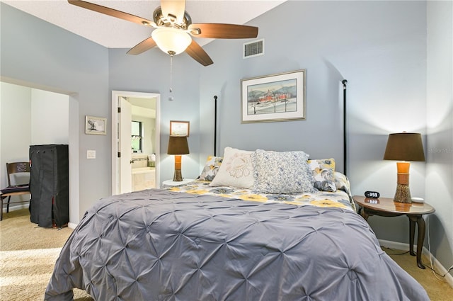 carpeted bedroom featuring ensuite bath and ceiling fan