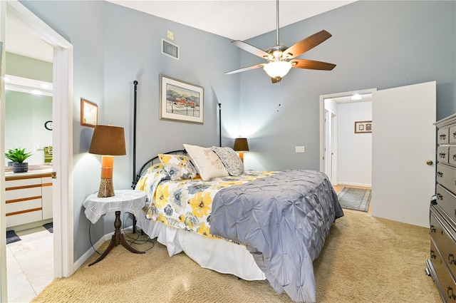 carpeted bedroom featuring vaulted ceiling and ceiling fan