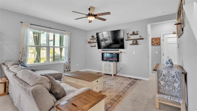 living room featuring light tile patterned floors and ceiling fan