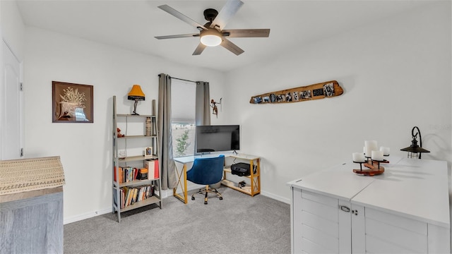 office area with ceiling fan and light colored carpet