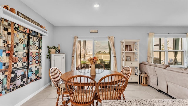 dining room featuring light tile patterned floors, baseboards, and recessed lighting