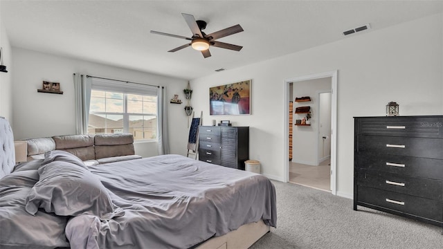 bedroom with visible vents, baseboards, carpet, and a ceiling fan