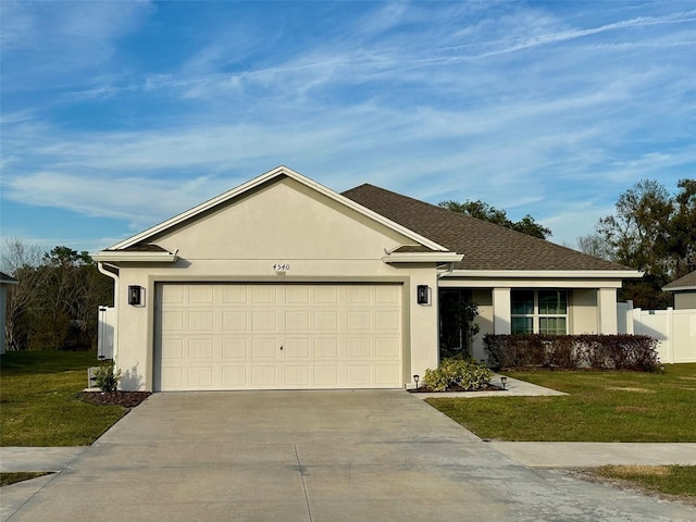 single story home with a garage and a front lawn