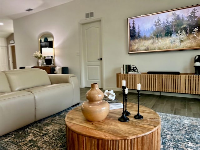 living room featuring radiator and dark wood-type flooring