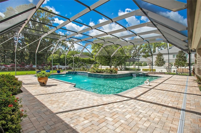 view of pool featuring a lanai, a patio area, and pool water feature