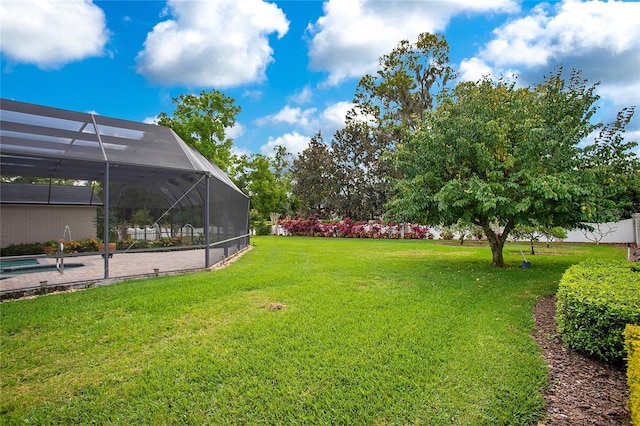 view of yard with a lanai