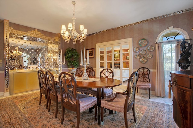 dining room with a notable chandelier