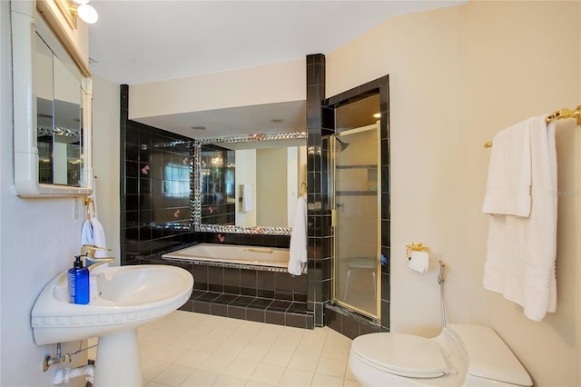 bathroom featuring toilet, plus walk in shower, and tile patterned flooring