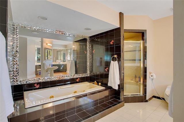 bathroom with plus walk in shower, tile patterned floors, and toilet