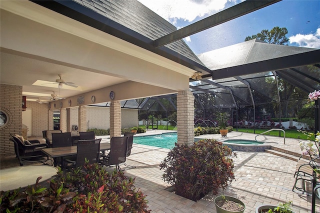 view of swimming pool with an in ground hot tub, ceiling fan, and a patio area