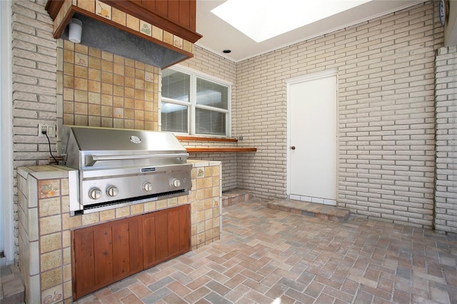 view of patio featuring grilling area and exterior kitchen