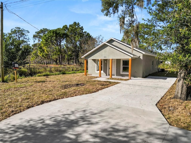 view of front of property with a porch and a front lawn