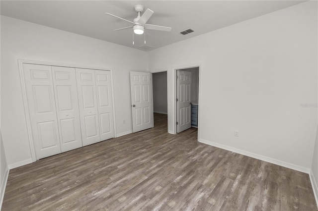 unfurnished bedroom featuring light hardwood / wood-style floors, a closet, and ceiling fan