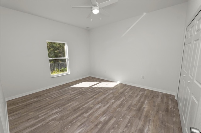 spare room featuring hardwood / wood-style flooring and ceiling fan