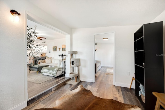 interior space featuring hardwood / wood-style floors and ceiling fan