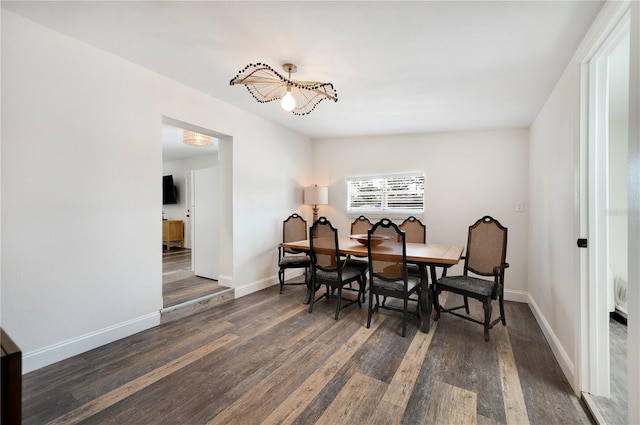 dining space featuring dark hardwood / wood-style floors