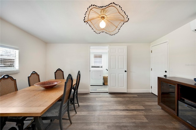 dining area with washer / clothes dryer and dark hardwood / wood-style floors