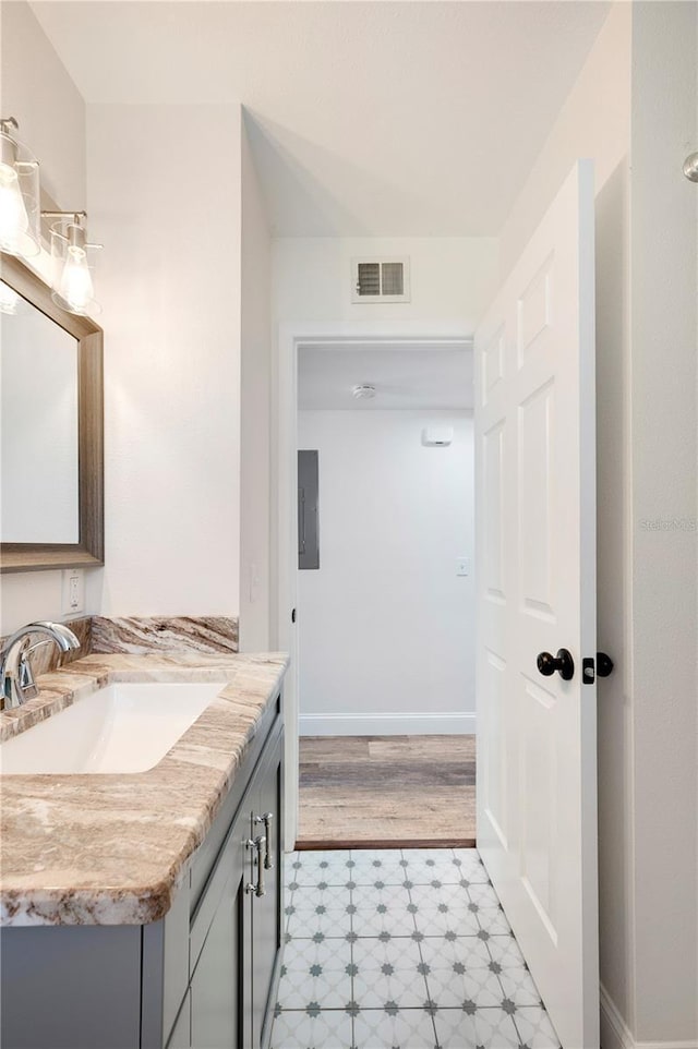 bathroom featuring vanity and electric panel