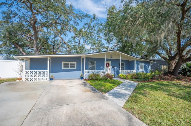 single story home featuring a front yard and covered porch