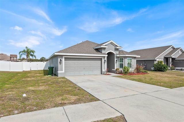 ranch-style house featuring a garage and a front yard