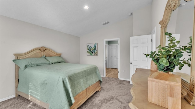 carpeted bedroom featuring vaulted ceiling