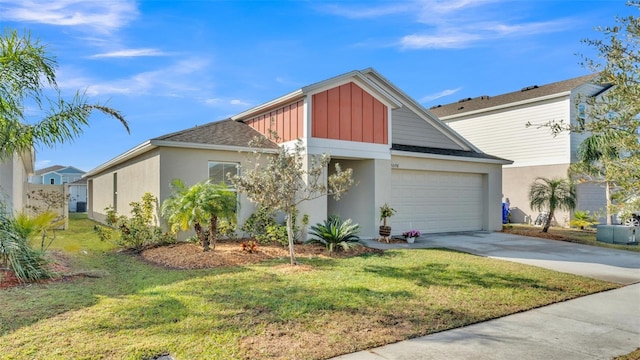 view of front of house with a garage and a front lawn