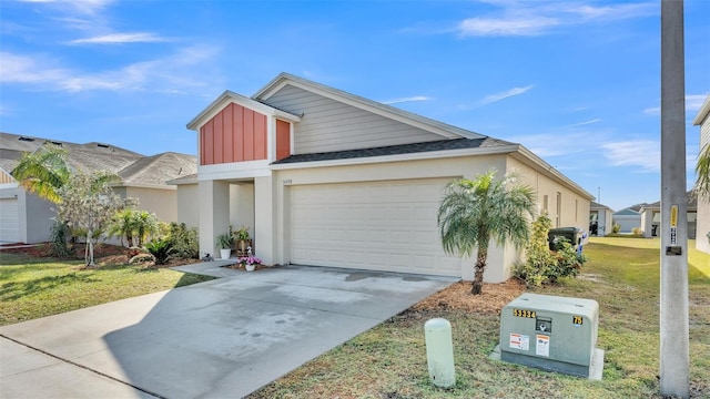 view of front of house featuring a garage and a front yard