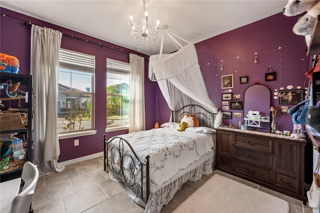 bedroom with a textured ceiling and a notable chandelier