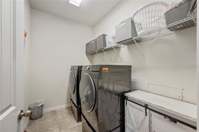 washroom featuring washer and clothes dryer