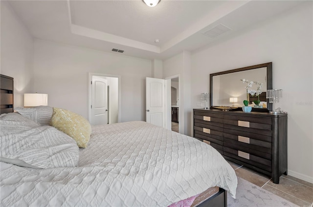 bedroom featuring a tray ceiling