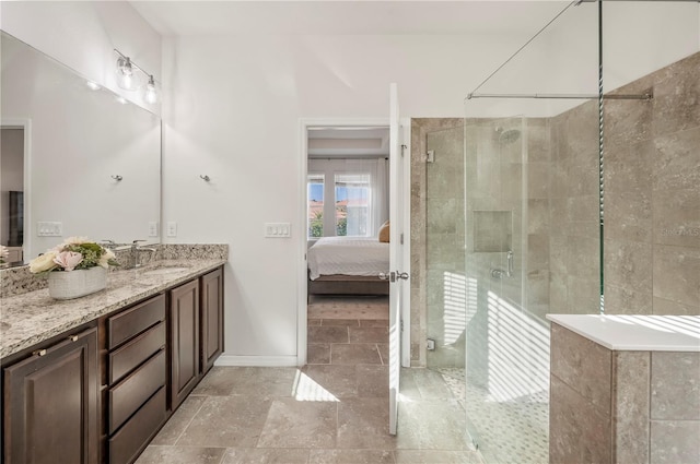 bathroom featuring an enclosed shower and vanity