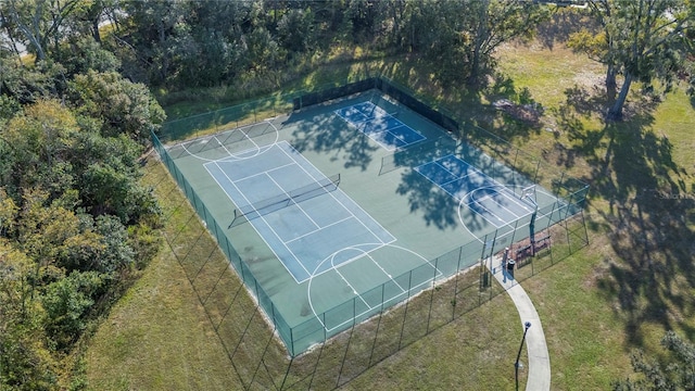 view of sport court with a yard and tennis court