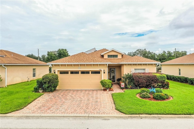 view of front of house featuring a garage and a front yard