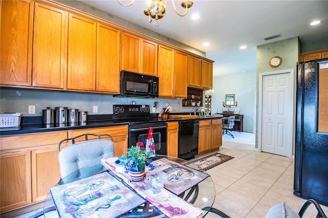 kitchen with sink, light tile patterned floors, an inviting chandelier, and black appliances