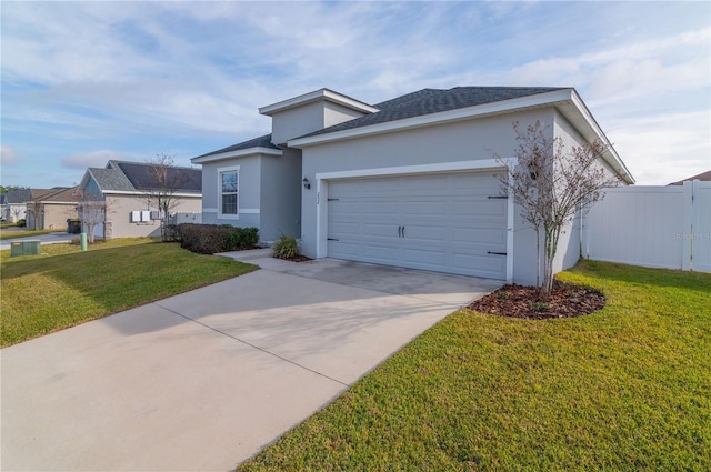 view of front of house featuring a garage, a front lawn, and central air condition unit