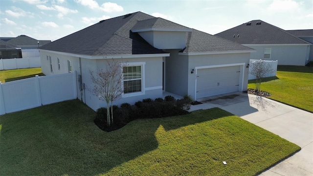 view of front of property featuring a garage and a front lawn