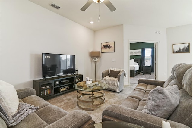 tiled living room featuring ceiling fan