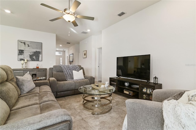 tiled living room with ceiling fan