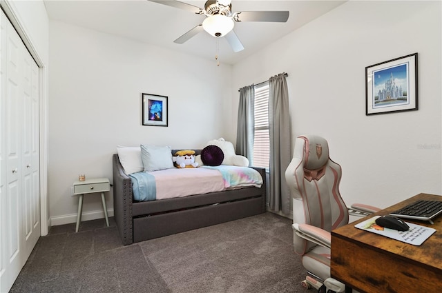 bedroom with a closet, ceiling fan, and dark colored carpet