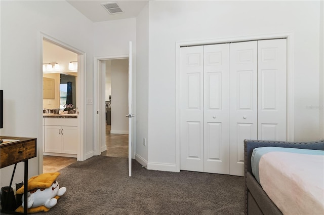 bedroom with carpet floors and a closet