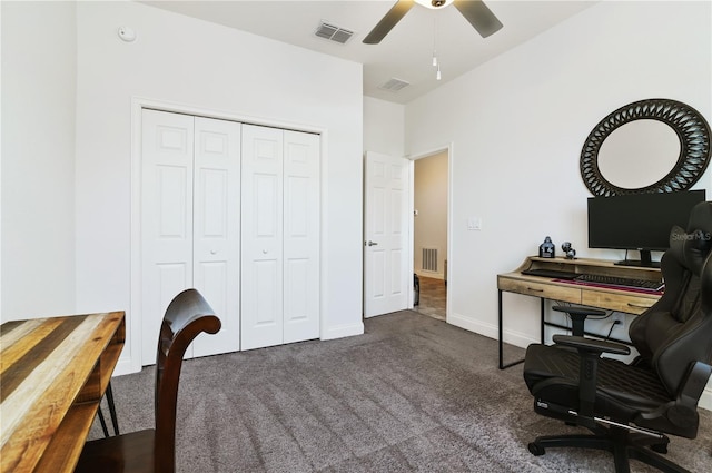 office with dark colored carpet and ceiling fan