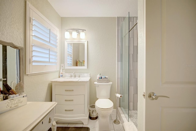 bathroom with vanity, toilet, an enclosed shower, and tile patterned flooring